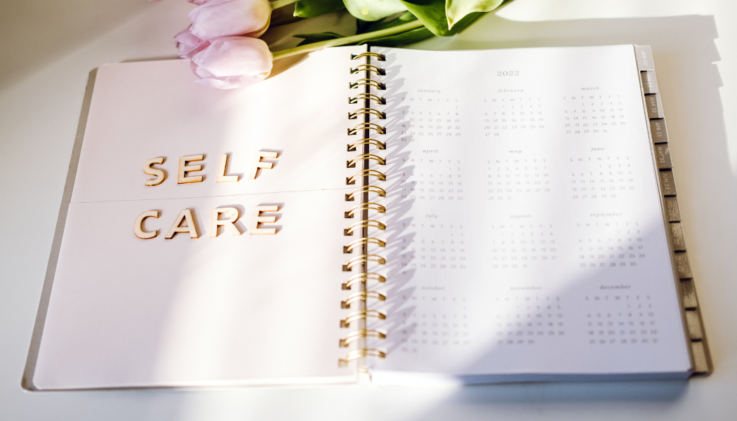 Photo of a journal saying self care